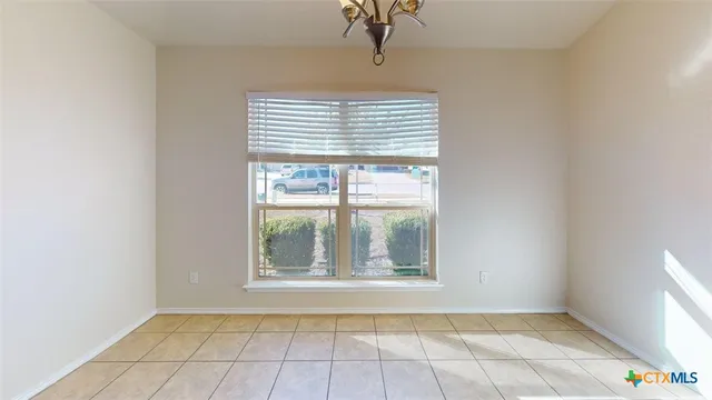 a bathroom with a granite countertop sink a mirror and a bathtub