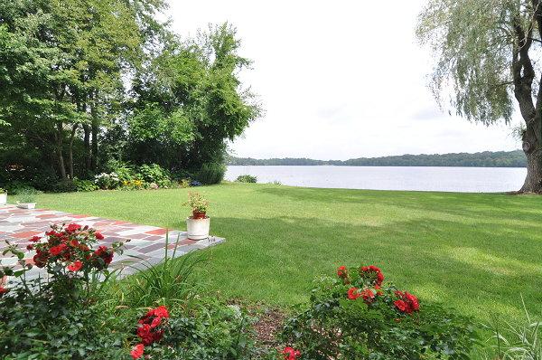 15 Parker Road Arlington, MA 02474 - Photo 18 of 19 a backyard of a house with lots of green space and fountain