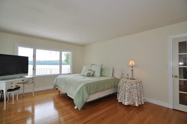 15 Parker Road Arlington, MA 02474 - Photo 7 of 19 a bedroom with a bed and a flat screen tv