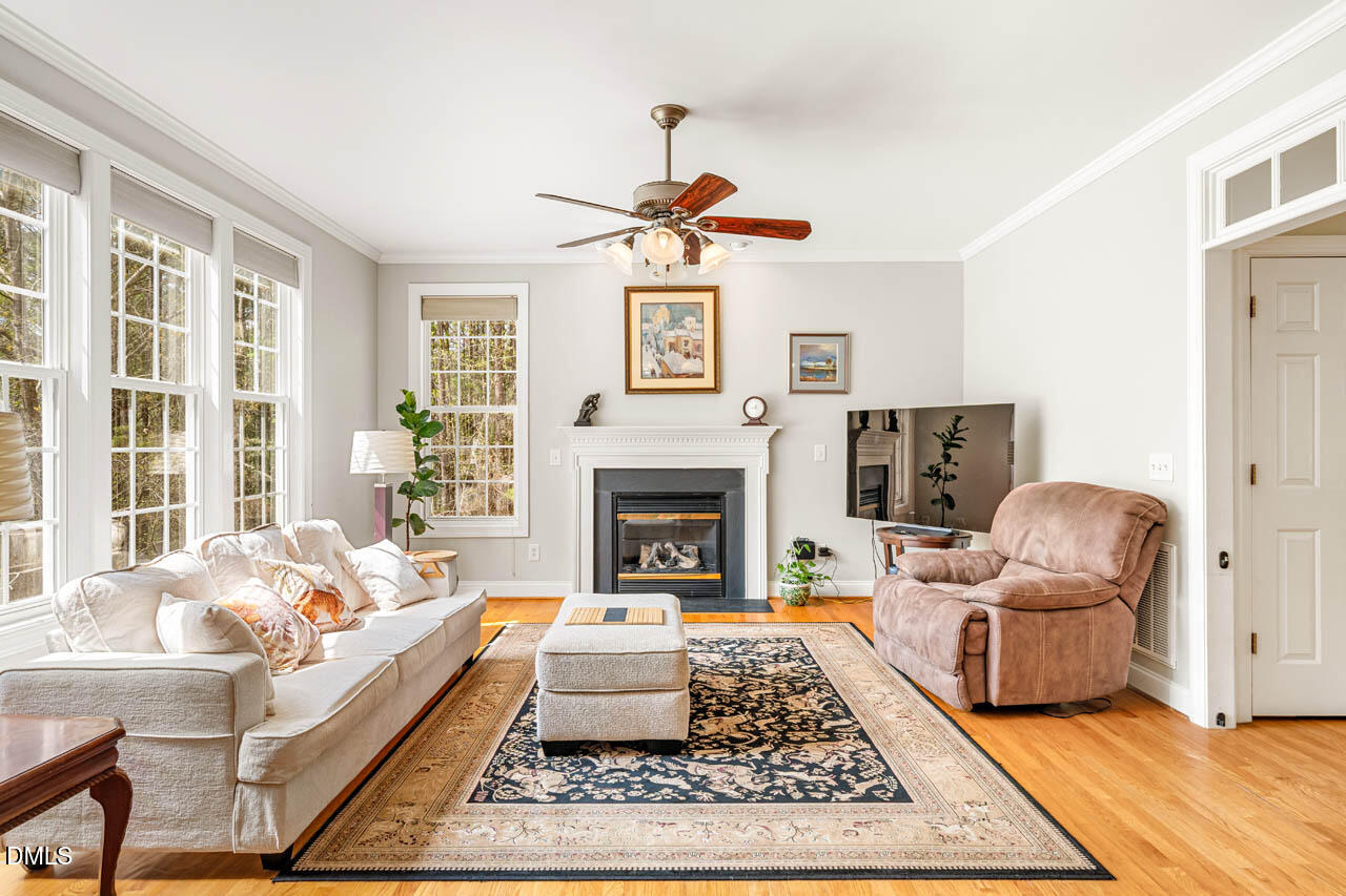 265 Old Chestnut Crossing Moncure, NC 27559 - Photo 10 of 45 a living room with furniture and a fireplace