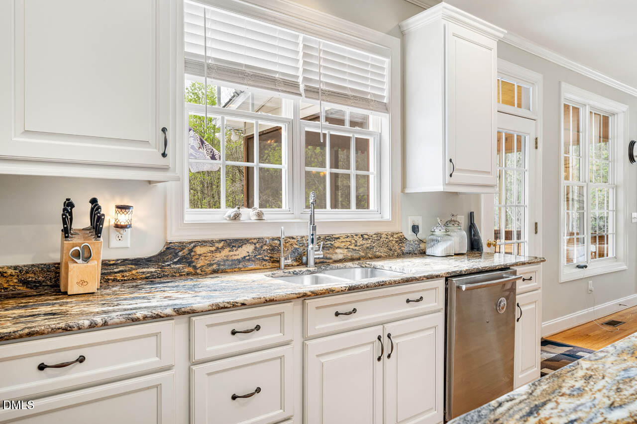 265 Old Chestnut Crossing Moncure, NC 27559 - Photo 17 of 45 a kitchen with granite countertop a sink and a window