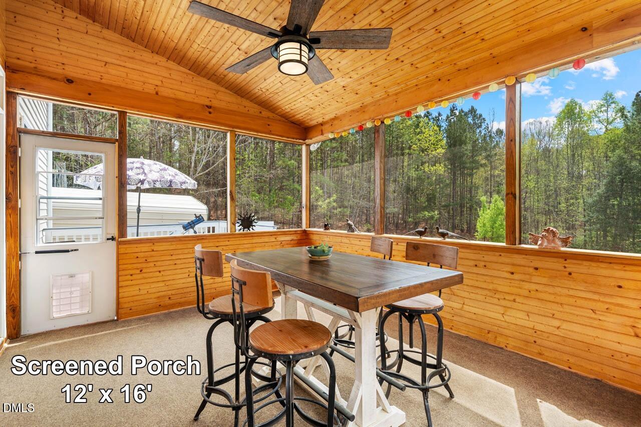 265 Old Chestnut Crossing Moncure, NC 27559 - Photo 19 of 45 a view of a patio with a table chairs and wooden floor