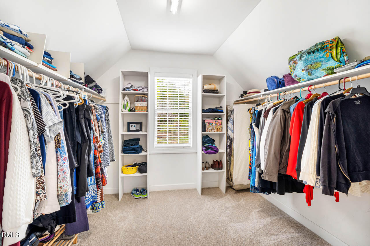 265 Old Chestnut Crossing Moncure, NC 27559 - Photo 24 of 45 a view of walk in closet with clothes and shoes