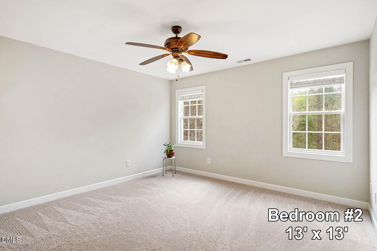 265 Old Chestnut Crossing Moncure, NC 27559 - Photo 26 of 45 an empty room with windows and fan