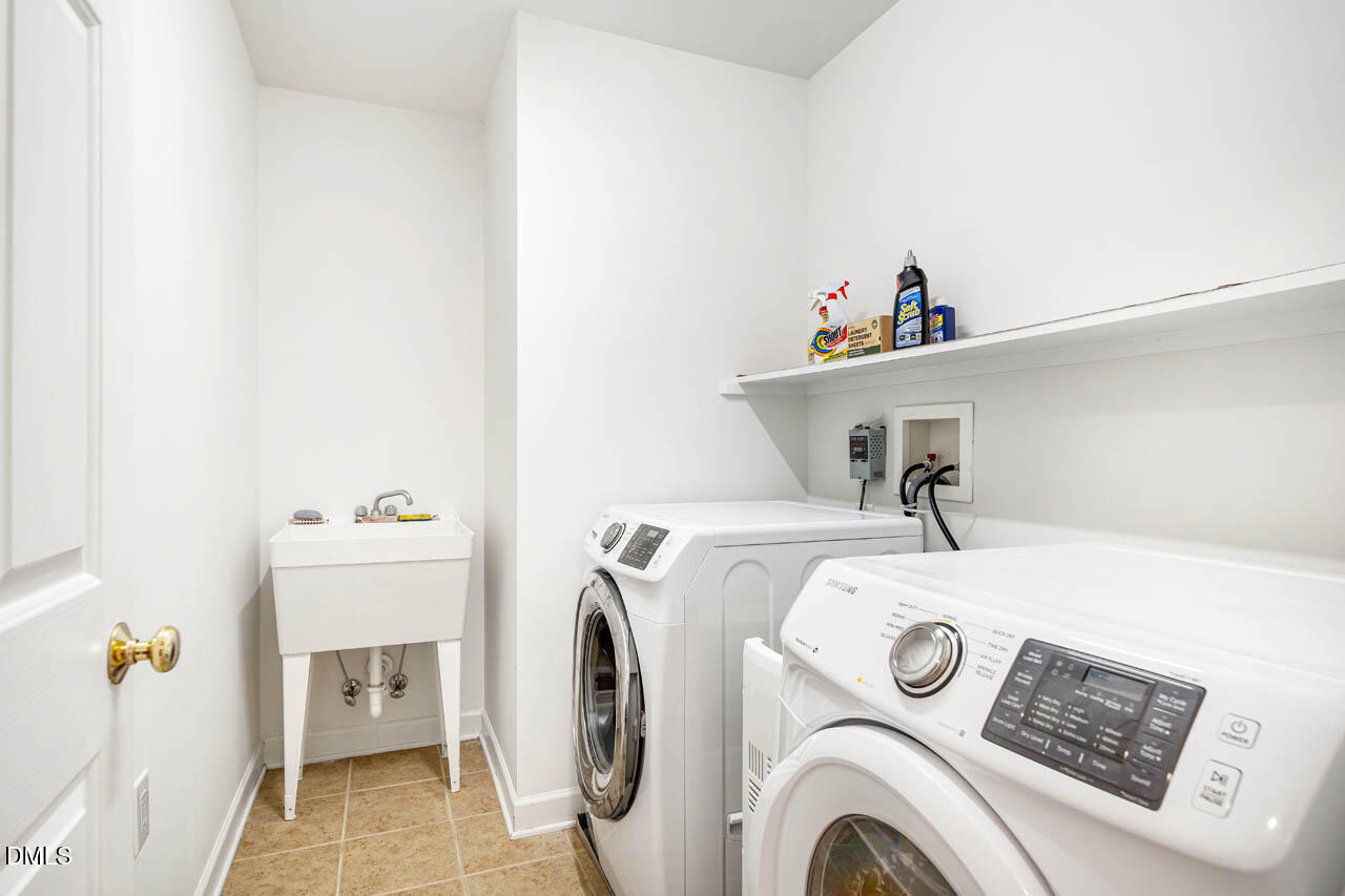 265 Old Chestnut Crossing Moncure, NC 27559 - Photo 30 of 45 a utility room with dryer and washer