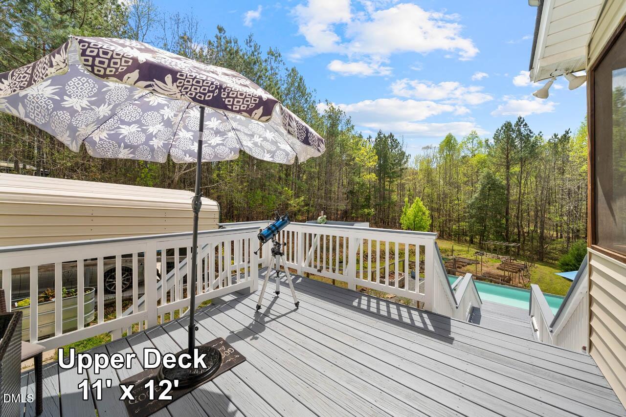 265 Old Chestnut Crossing Moncure, NC 27559 - Photo 32 of 45 a view of a wooden deck with furniture