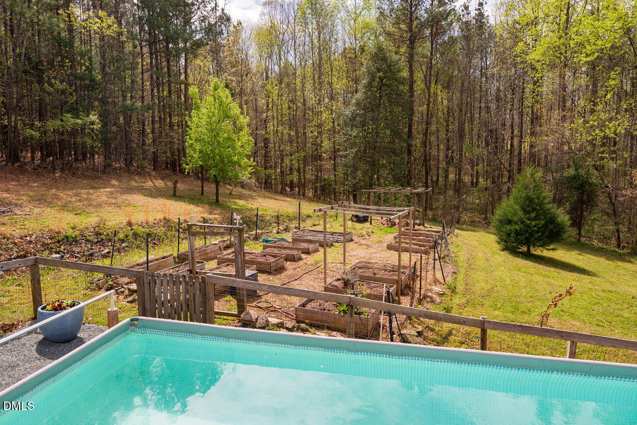 265 Old Chestnut Crossing Moncure, NC 27559 - Photo 35 of 45 a view of yard with swimming pool and seating