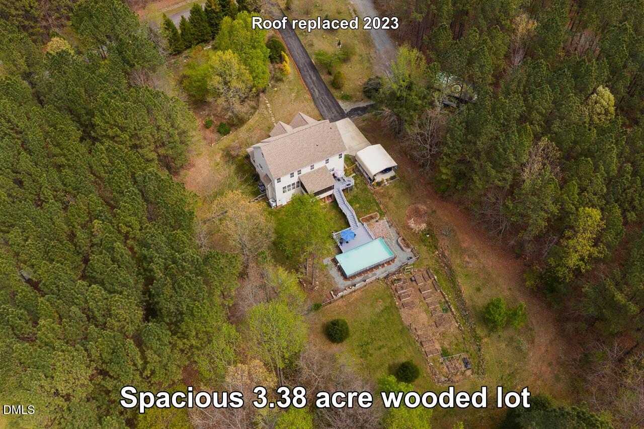 265 Old Chestnut Crossing Moncure, NC 27559 - Photo 3 of 45 a view of a house with a yard