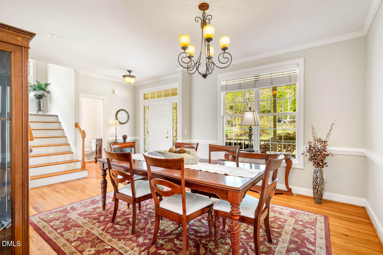 265 Old Chestnut Crossing Moncure, NC 27559 - Photo 6 of 45 a view of a dining room with furniture window and wooden floor