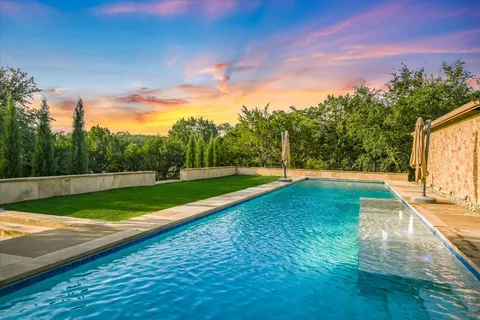 a view of a park with large trees