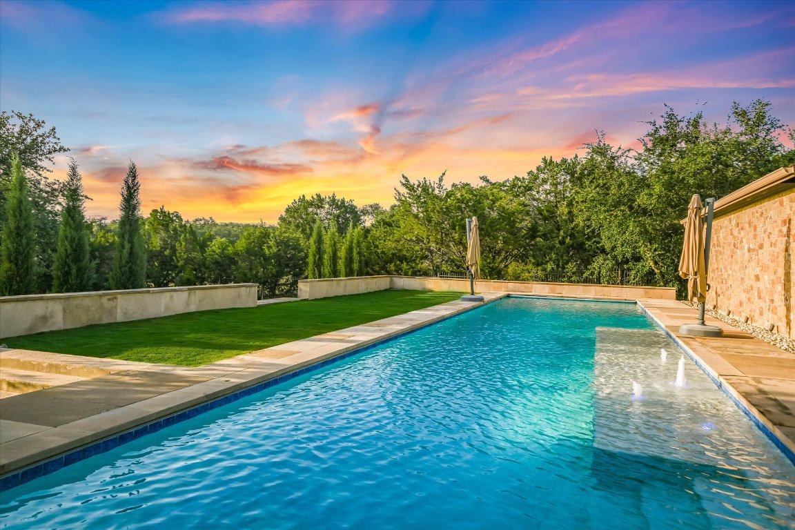 a view of a park with large trees