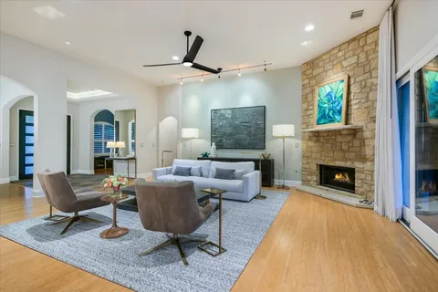 a living room with furniture and a fireplace