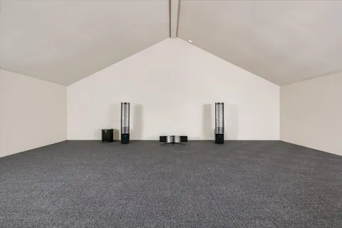 a view of a bathroom with a sink and mirror