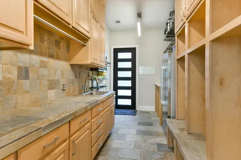 a view of a bedroom with a window and wooden floor