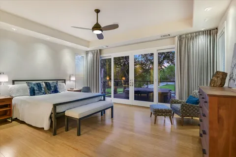 a spacious bathroom with a shower sink and mirror