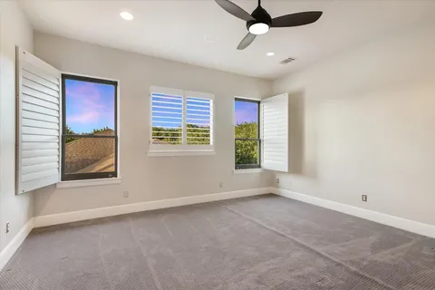 a bedroom with furniture and wooden floor