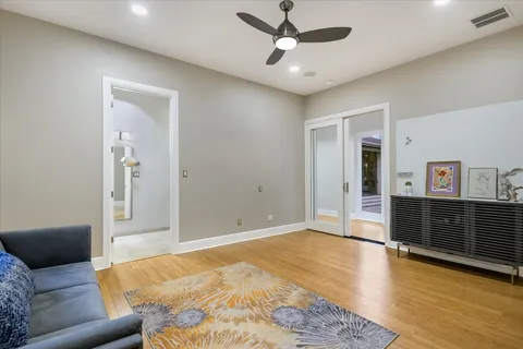 a view of a hallway with wooden floor