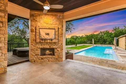 a view of a kitchen with a sink and a refrigerator