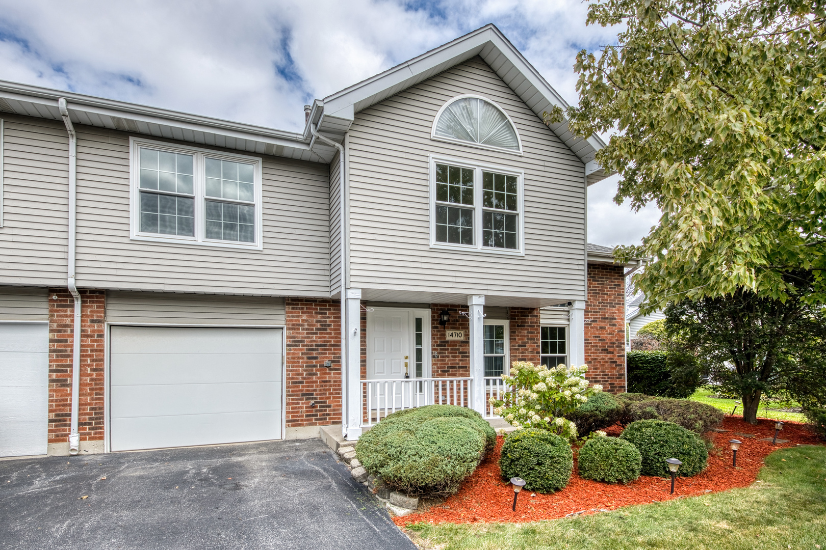 14710 Kenton Avenue Midlothian, IL 60445 - Photo 1 of 20 a front view of a house with a yard
