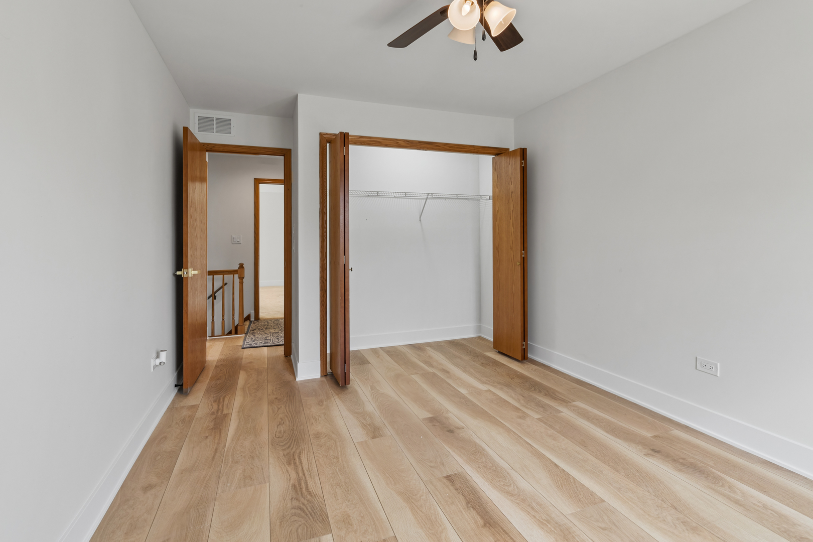 14710 Kenton Avenue Midlothian, IL 60445 - Photo 12 of 20 wooden floor in an empty room with a window
