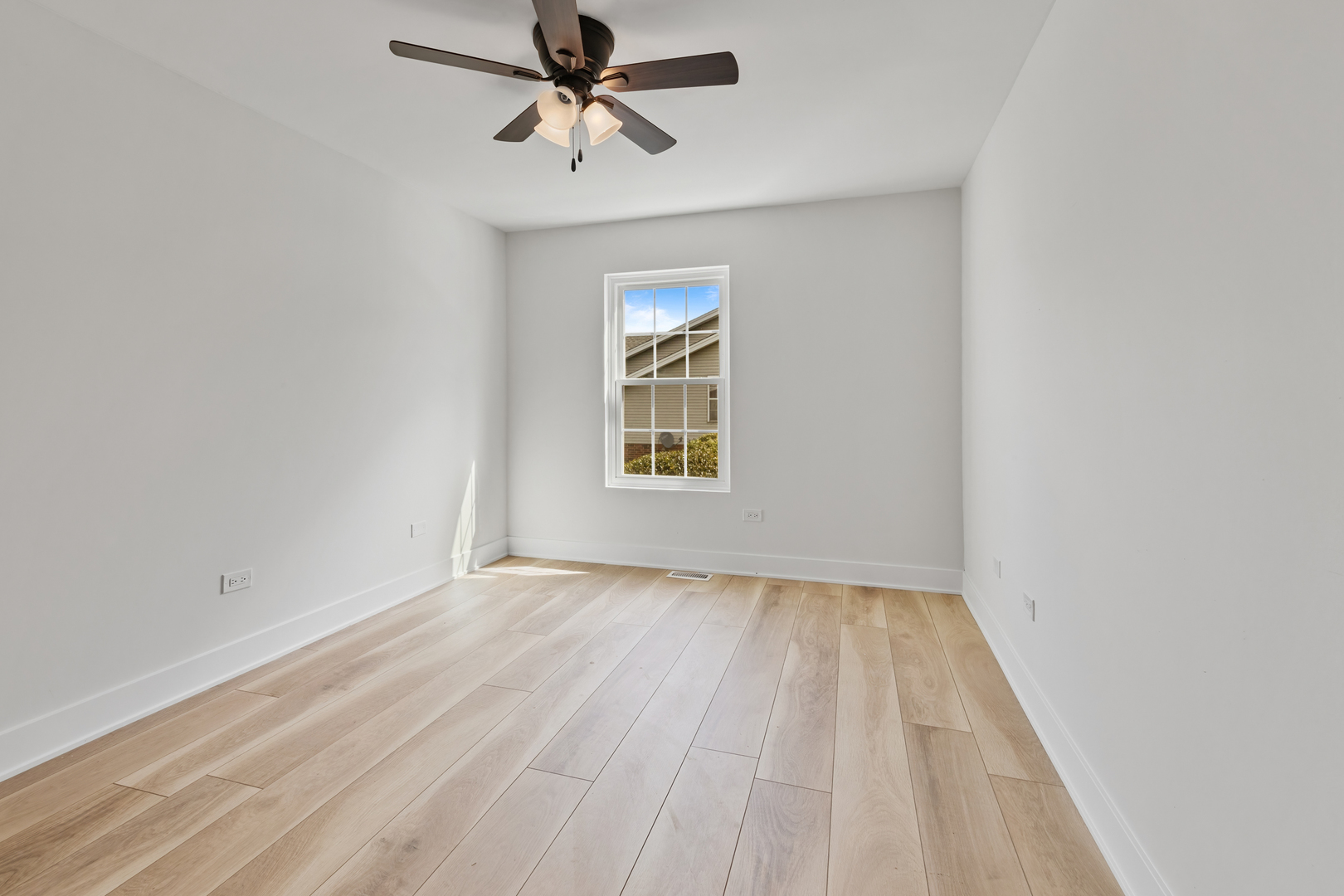 14710 Kenton Avenue Midlothian, IL 60445 - Photo 13 of 20 a view of empty room with wooden floor and fan