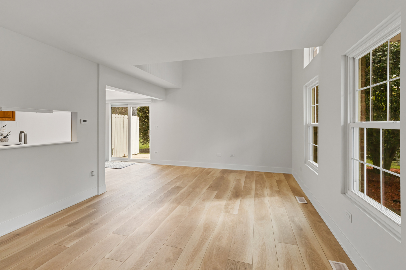 14710 Kenton Avenue Midlothian, IL 60445 - Photo 4 of 20 wooden floor in an empty room with a window