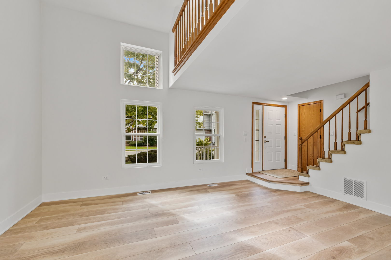 14710 Kenton Avenue Midlothian, IL 60445 - Photo 5 of 20 a view of an empty room with wooden floor and a window