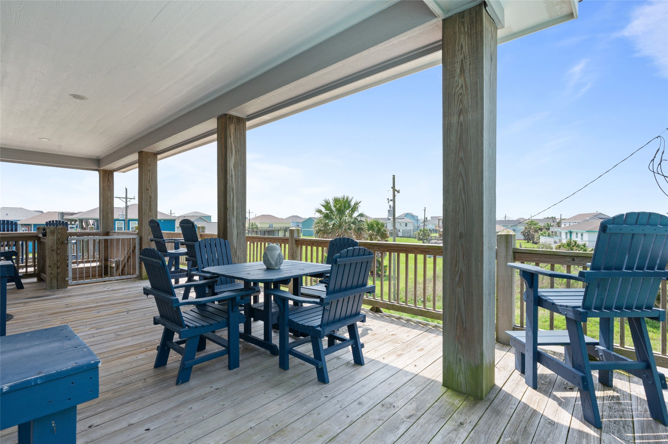 982 South Redfish Crystal Beach, TX 77650 - Photo 11 of 44 a view of a dining room with furniture and wooden floor