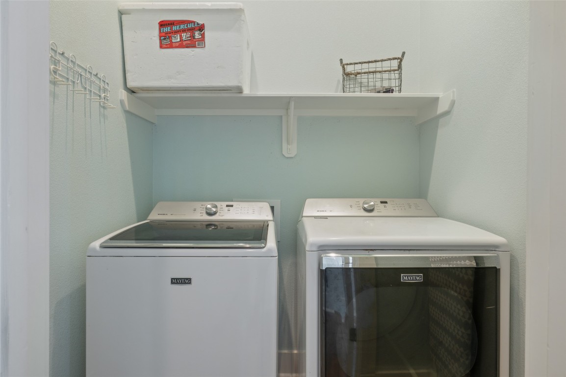 982 South Redfish Crystal Beach, TX 77650 - Photo 16 of 44 a utility room with dryer and washer