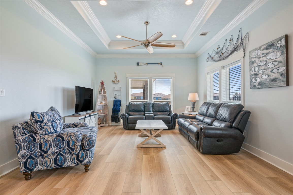 982 South Redfish Crystal Beach, TX 77650 - Photo 17 of 44 a living room with furniture or couch and a flat screen tv