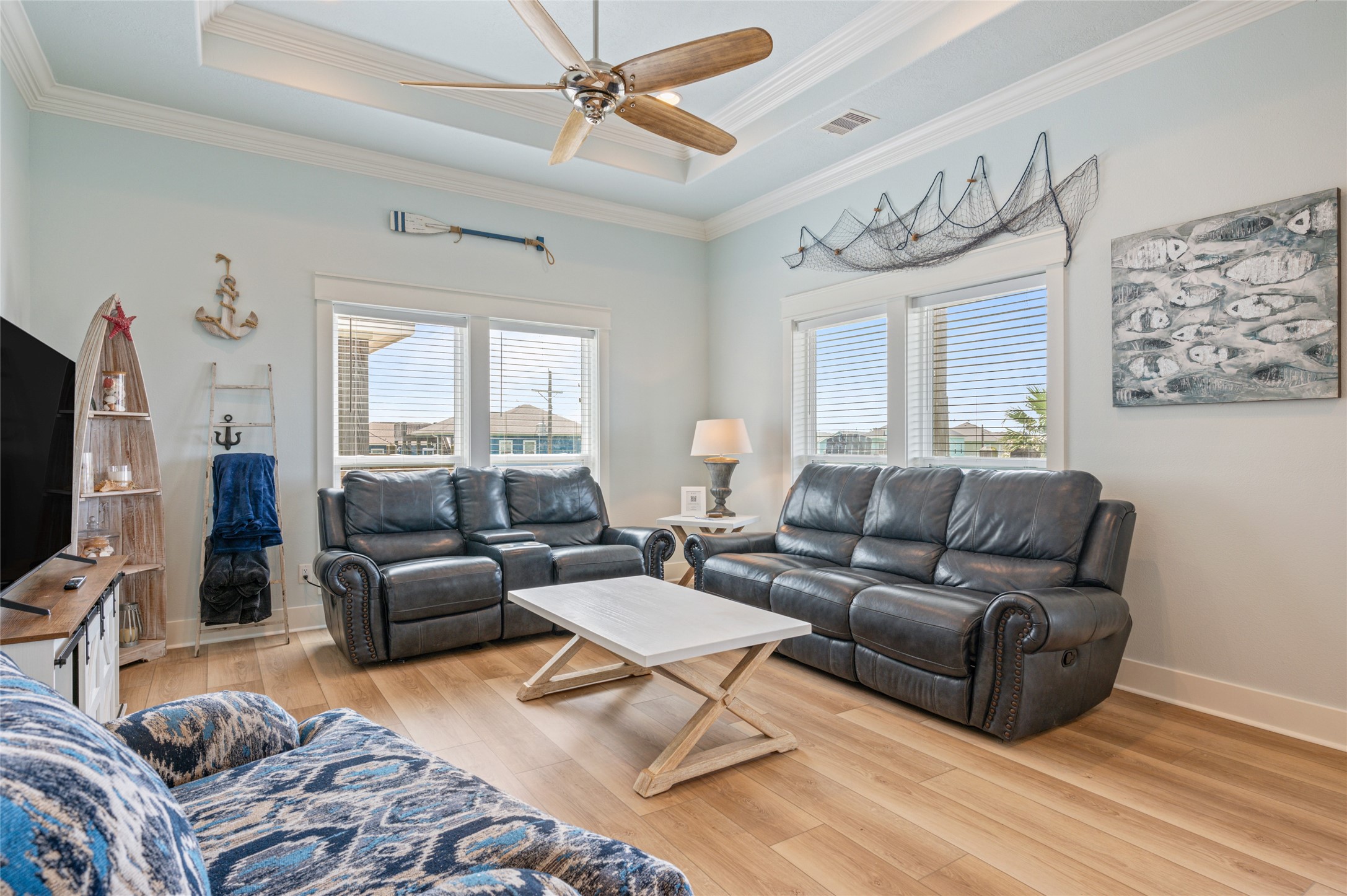 982 South Redfish Crystal Beach, TX 77650 - Photo 18 of 44 a living room with furniture ceiling fan and a window