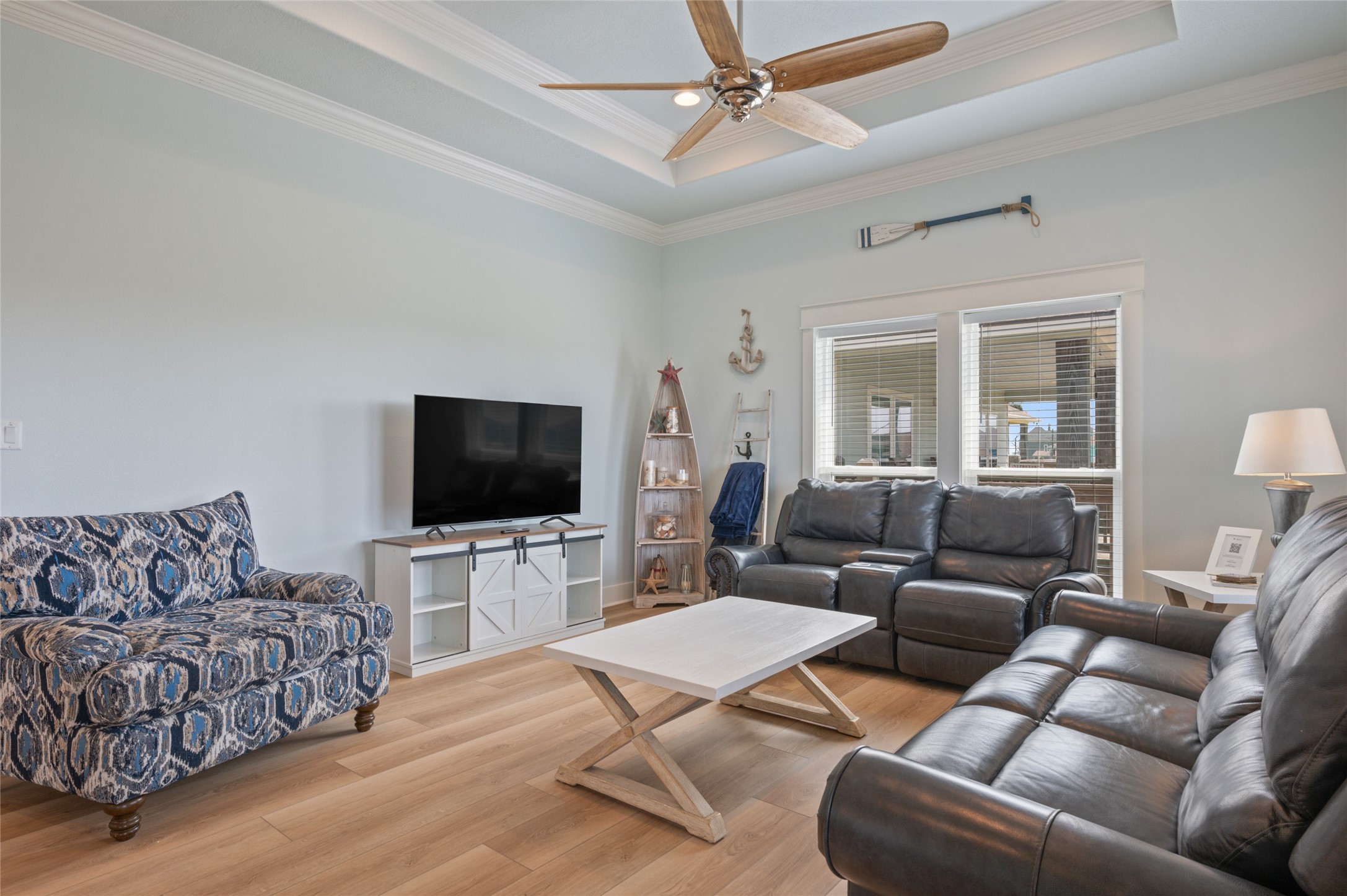 982 South Redfish Crystal Beach, TX 77650 - Photo 19 of 44 a living room with furniture and a flat screen tv