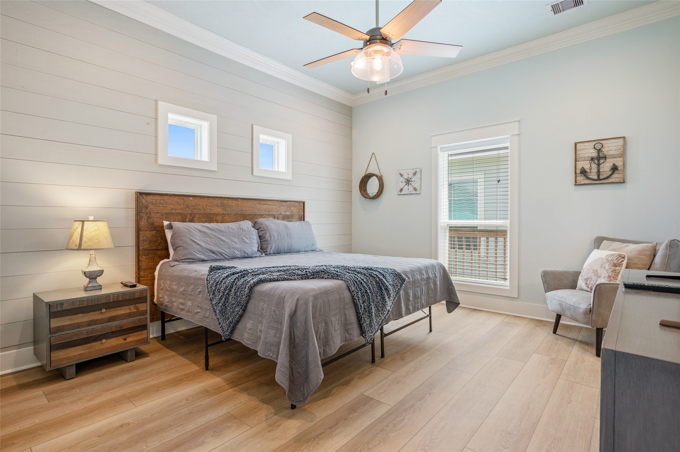 982 South Redfish Crystal Beach, TX 77650 - Photo 29 of 44 a bedroom with a bed and a chandelier