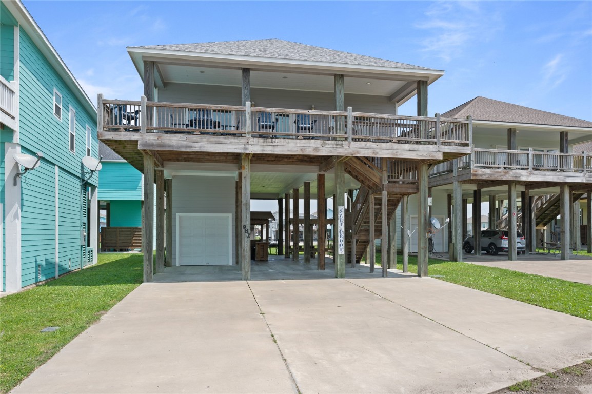 982 South Redfish Crystal Beach, TX 77650 - Photo 3 of 44 a view of a building with a pathway