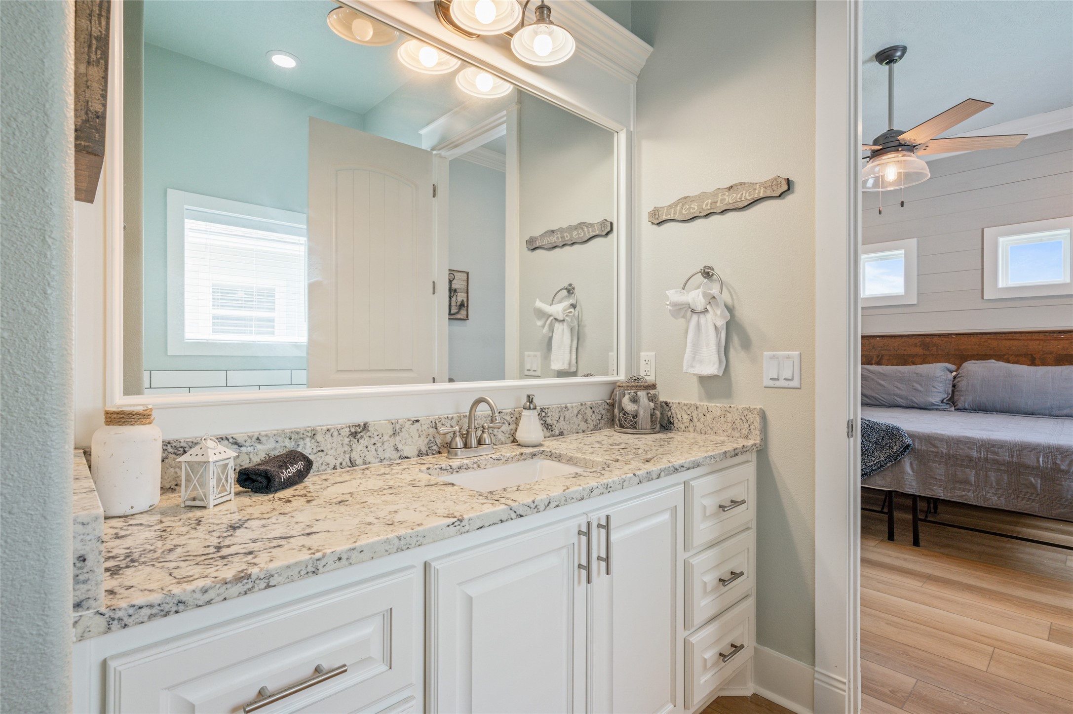982 South Redfish Crystal Beach, TX 77650 - Photo 35 of 44 a bathroom with a sink and a mirror