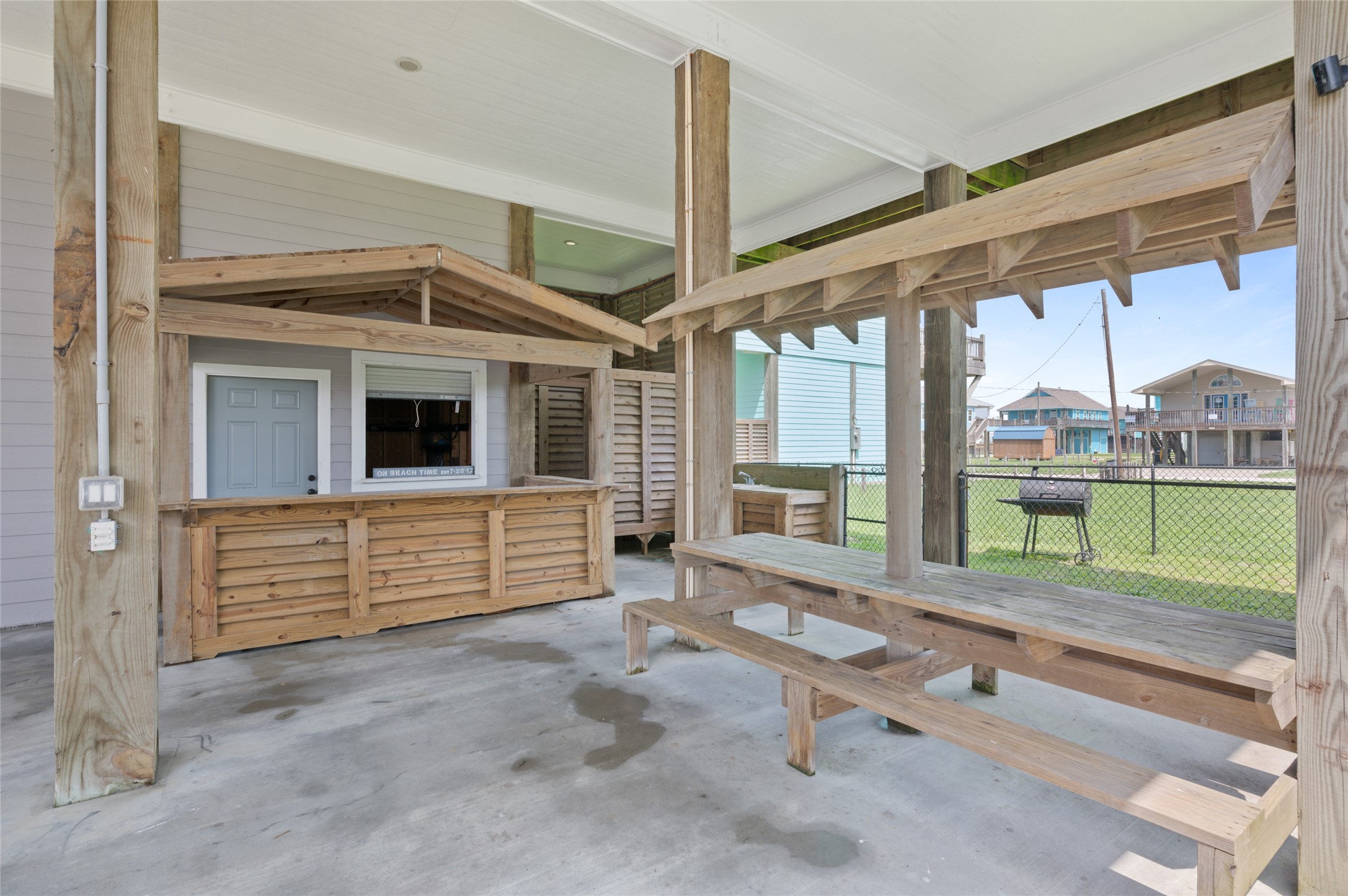 982 South Redfish Crystal Beach, TX 77650 - Photo 4 of 44 a room with lots of windows and furniture