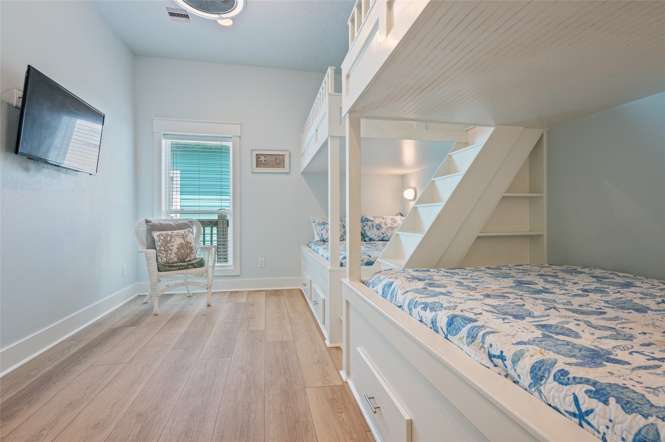 982 South Redfish Crystal Beach, TX 77650 - Photo 42 of 44 a bedroom with a bed and a flat screen tv