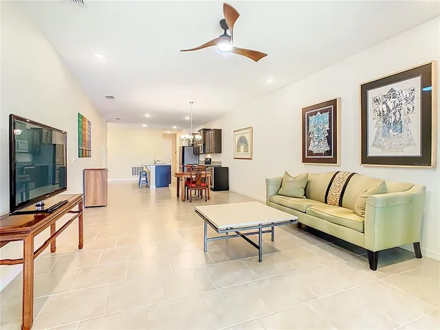 a bedroom with a bed and a television