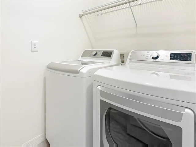 a view of a lake with a house in background