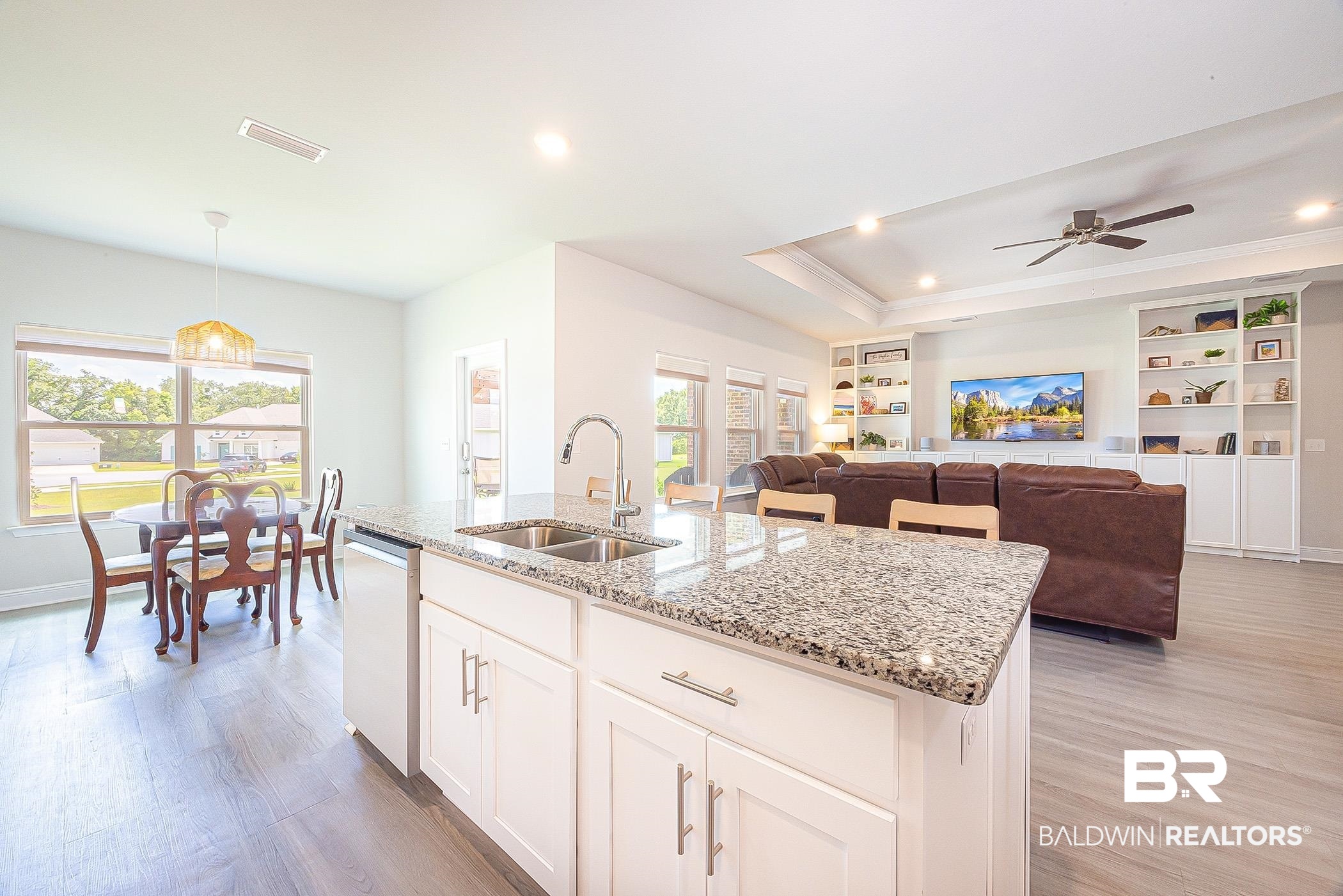 11044 Native Dancer Way Daphne, AL 36526 - Photo 15 of 67 Kitchen with dishwasher, light hardwood / wood-style floors, decorative light fixtures, and sink