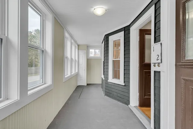 a view of an entryway with livingroom