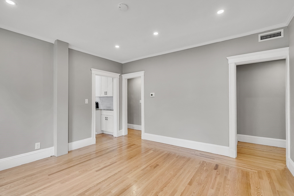 701 Hammond Street, Unit 1 Brookline, MA 02467 - Photo 8 of 28 a view of empty room with wooden floor