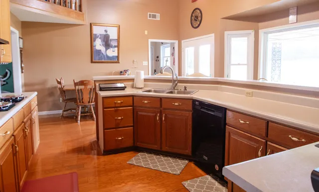 a spacious bathroom with a sink and a mirror