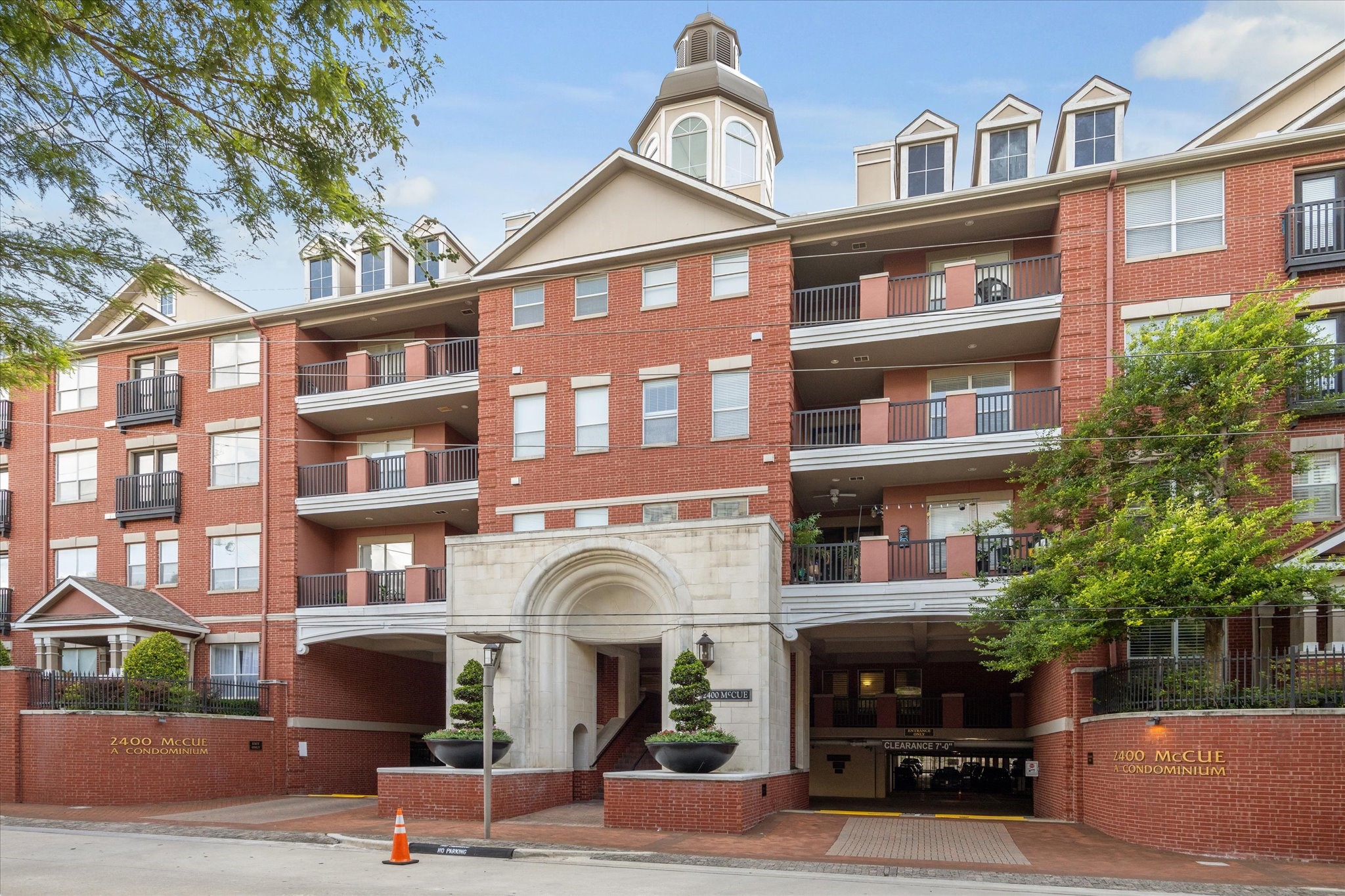 2400 McCue Road, Unit 460 Houston, TX 77056 - Photo 14 of 21 a front view of a residential apartment building with a yard