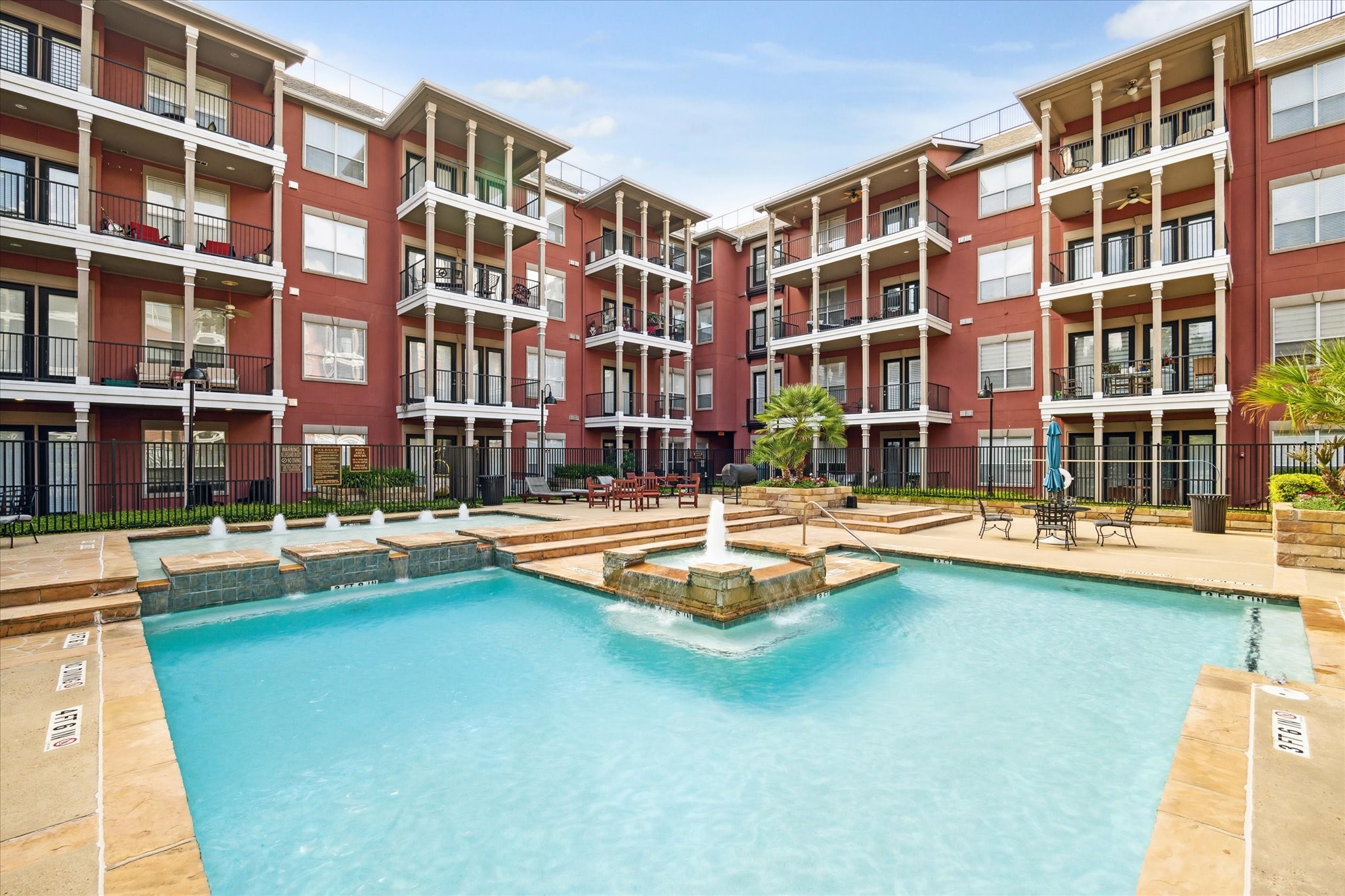 2400 McCue Road, Unit 460 Houston, TX 77056 - Photo 21 of 21 a front view of a building with swimming pool and brick wall