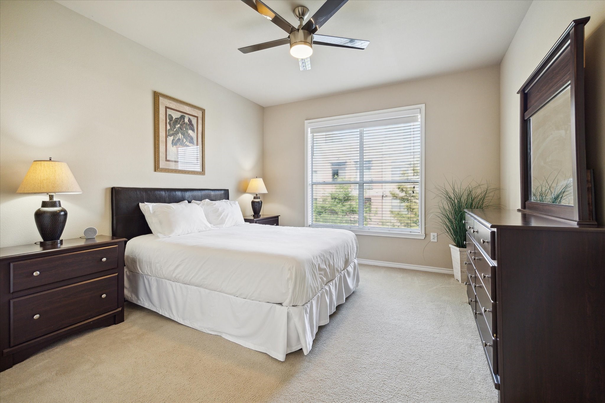 2400 McCue Road, Unit 460 Houston, TX 77056 - Photo 9 of 21 a spacious bedroom with a bed and a large window