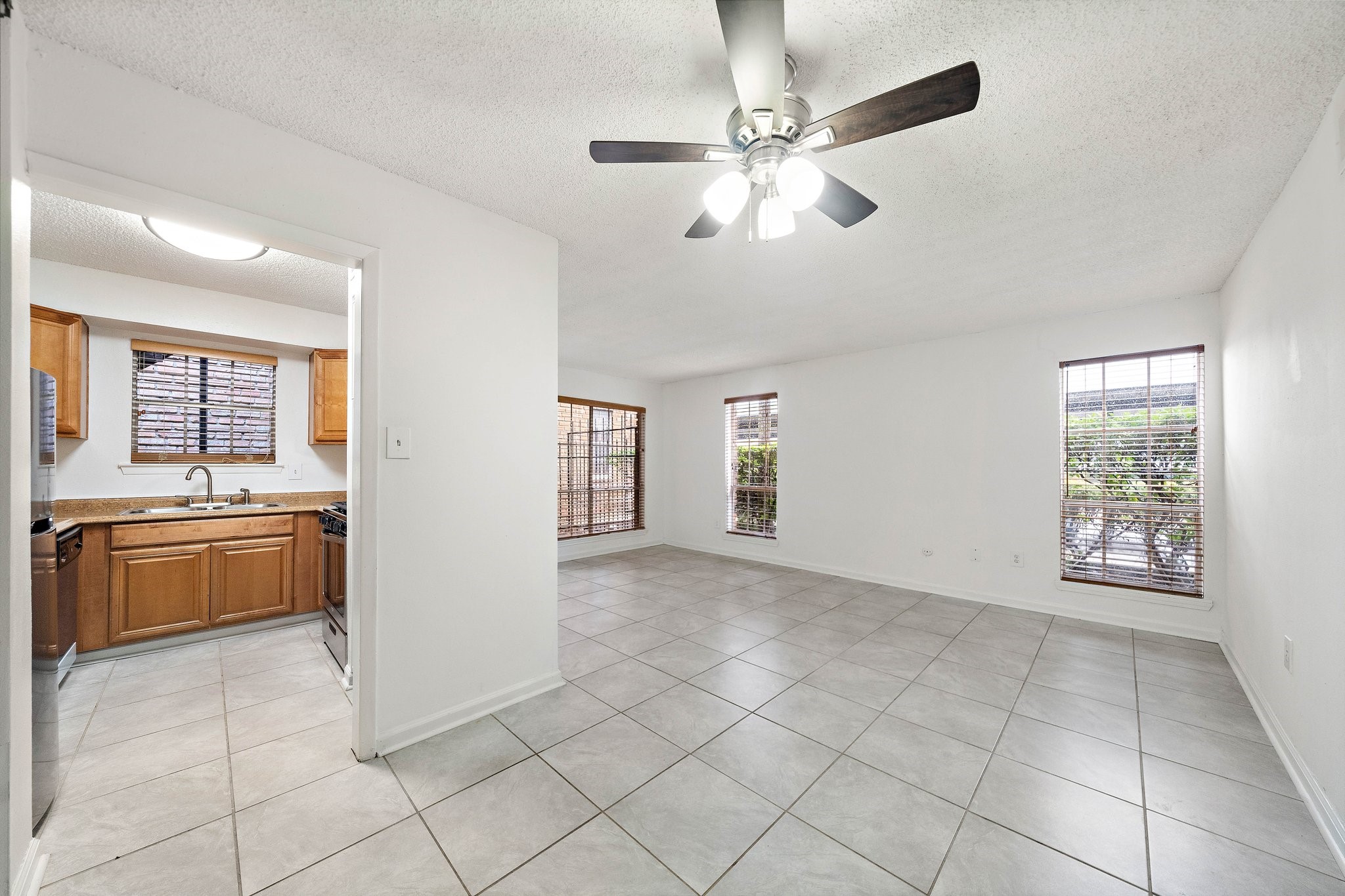 711 Holiday Drive, Unit 63 Galveston, TX 77550 - Photo 4 of 10 a view of an empty room with a kitchen