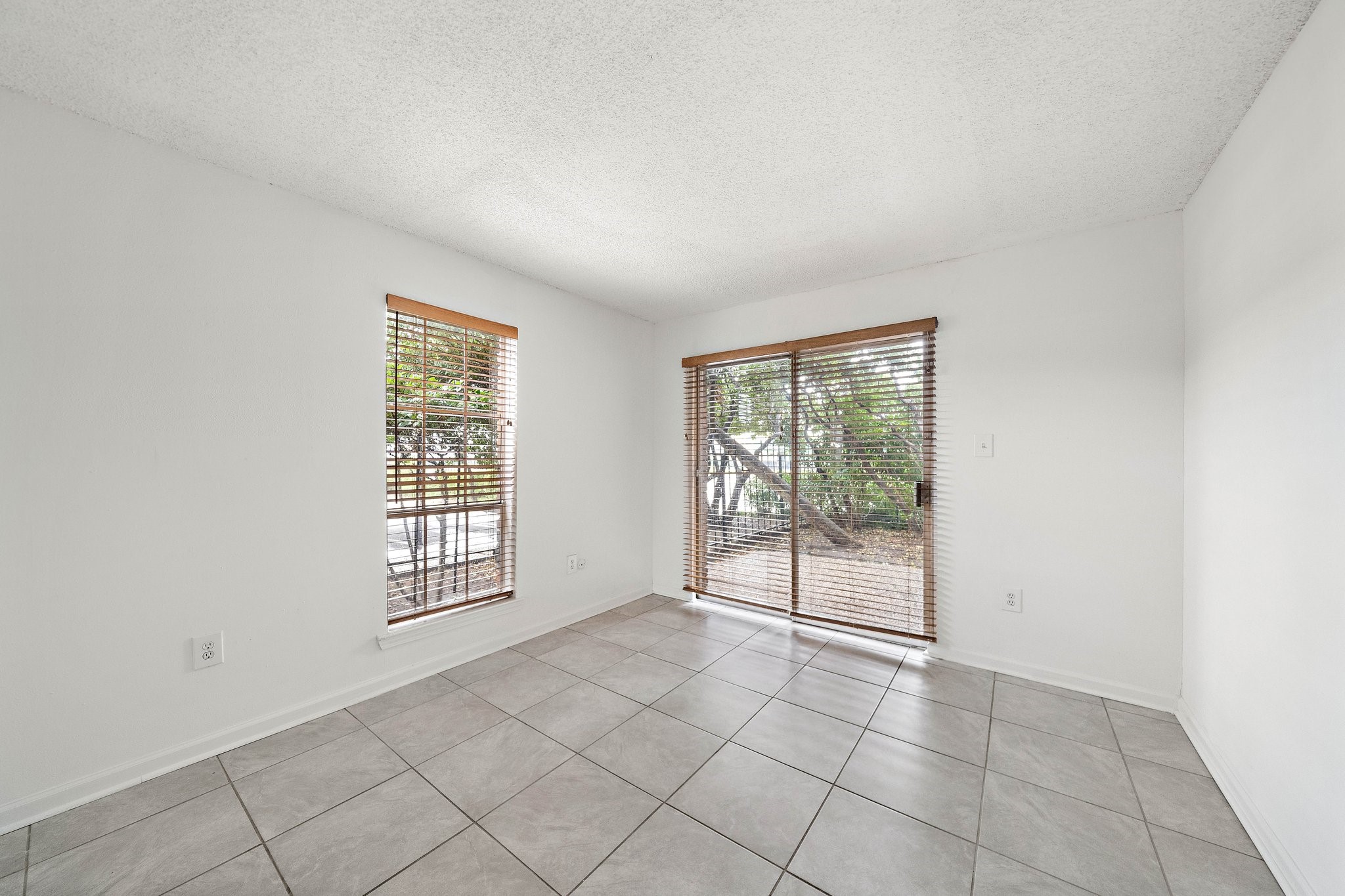711 Holiday Drive, Unit 63 Galveston, TX 77550 - Photo 7 of 10 an empty room with windows