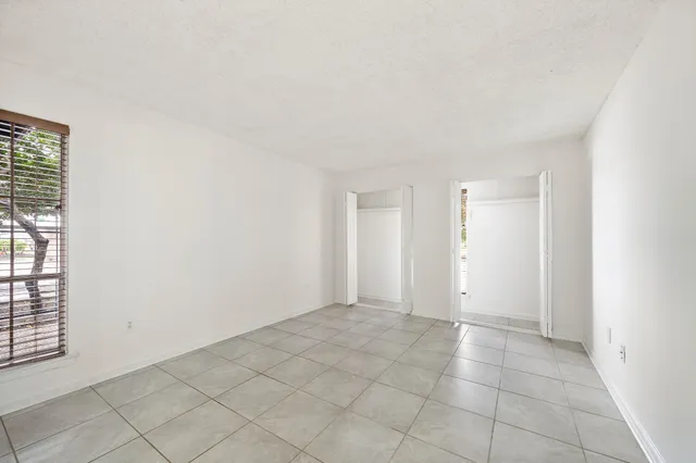 a bathroom with a toilet sink vanity and mirror