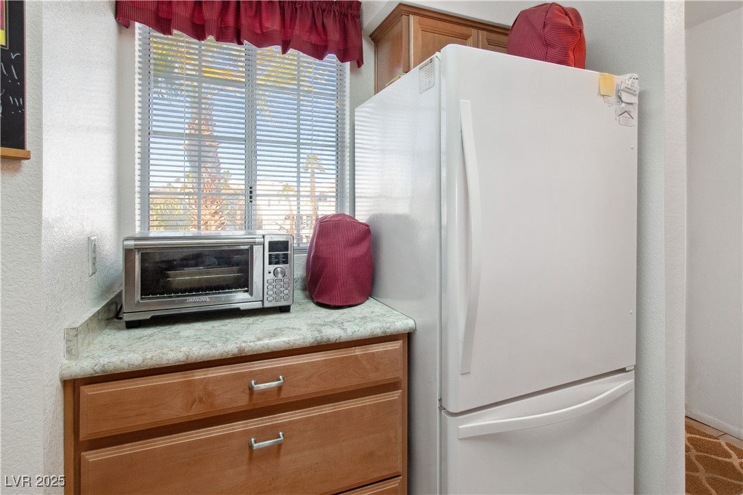 2044 Mesquite Lane, Unit 302 Laughlin, NV 89029 - Photo 7 of 45 The Kitchen has white countertops and wood cabinet